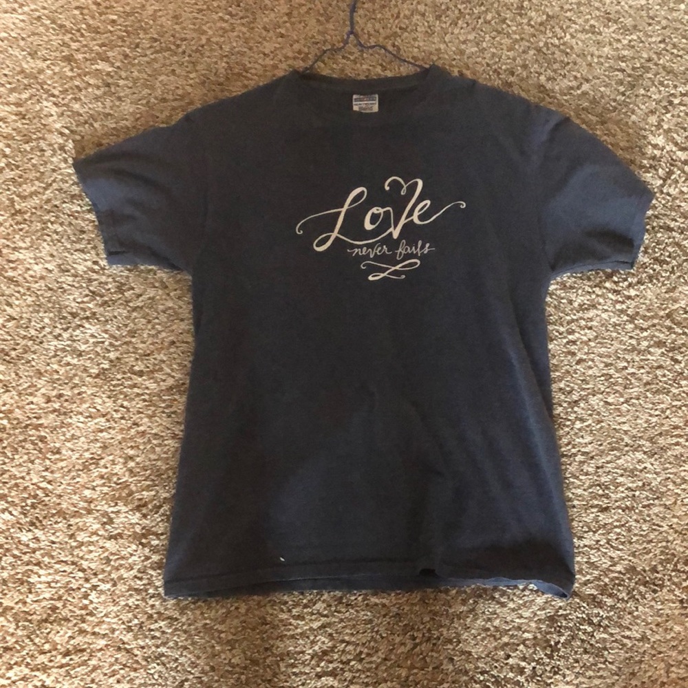 Navy blue “love never fails” graphic T-shirt